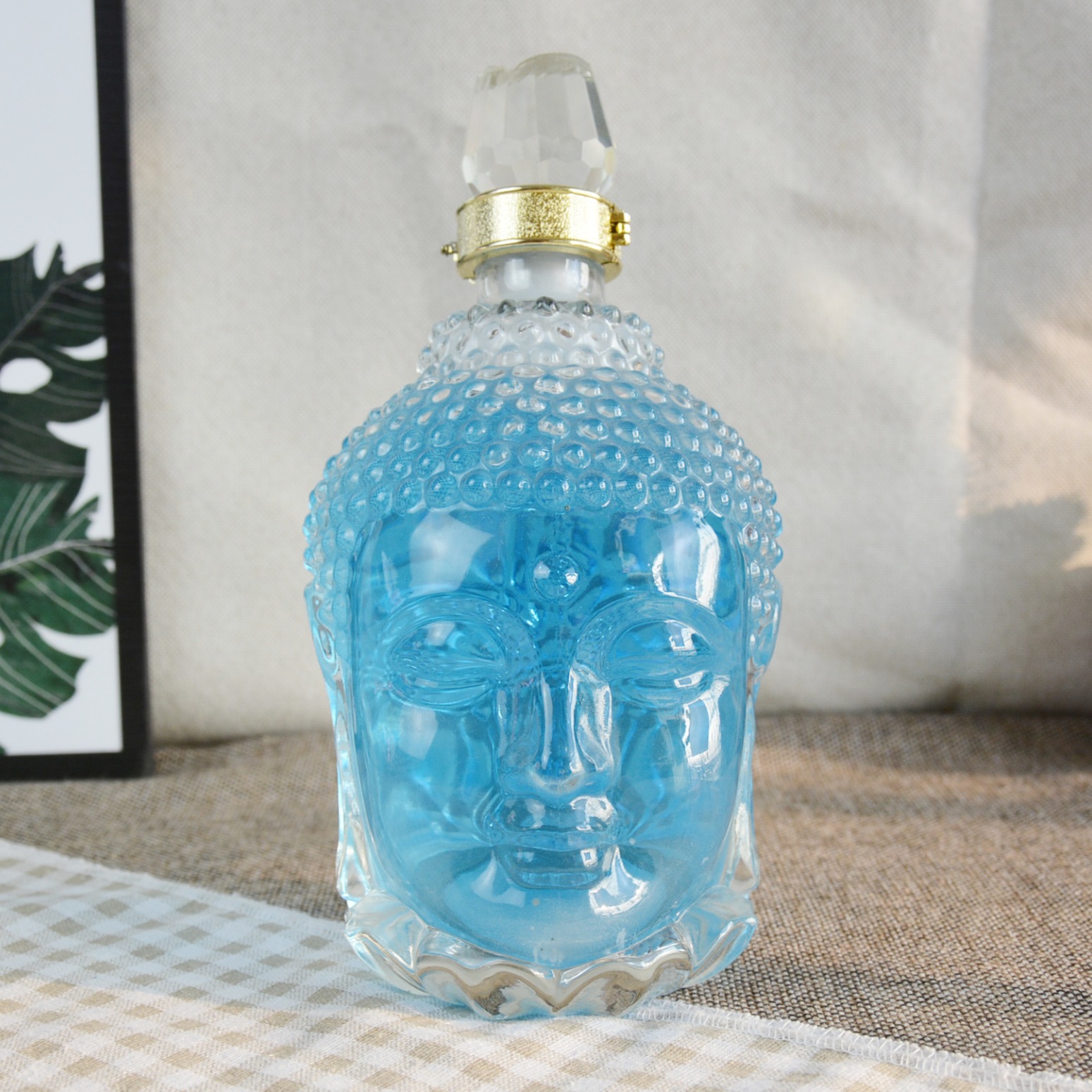 郓城包装厂家供应佛头造型晶白料玻璃瓶